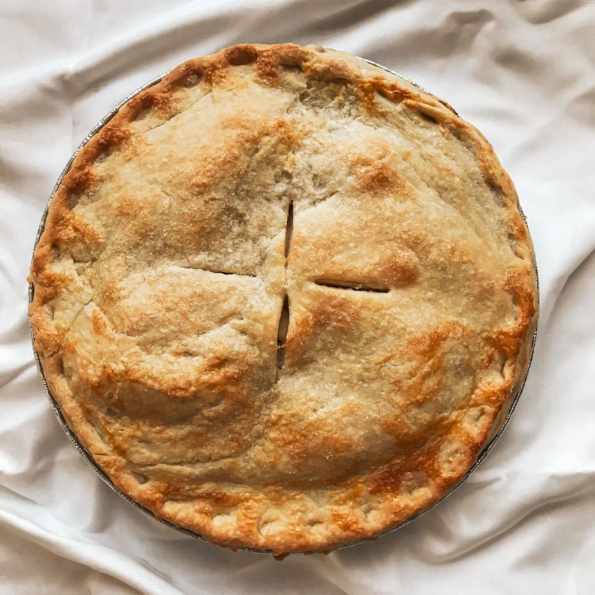 Cakes & Bakes's own photograph: a golden apple pie fresh from the oven.